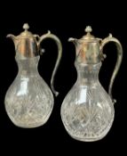 PAIR OF CUT GLASS & ELECTROPLATE MOUNTED CLARET JUGS, with scroll handles and hinged lids, 30cms
