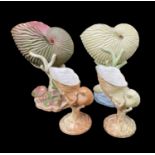 FOUR ROYAL WORCESTER NAUTILUS SHELL VASES, the two larger examples (17cms high) in unusual