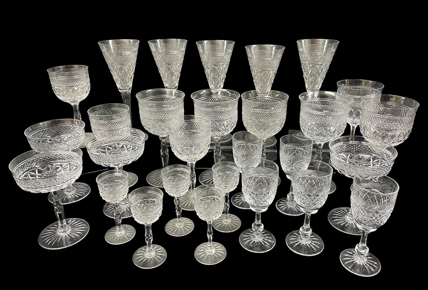 SUITE OF GOOD QUALITY VINTAGE CUT GLASS DRINKING GLASSES, decorated with hobnail and facet, shaped
