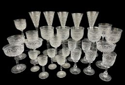 SUITE OF GOOD QUALITY VINTAGE CUT GLASS DRINKING GLASSES, decorated with hobnail and facet, shaped