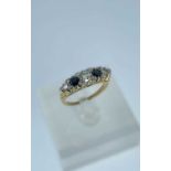 18CT GOLD FIVE STONE DIAMOND & SAPPHIRE RING, the central diamond measuring 0.25cts approx., ring