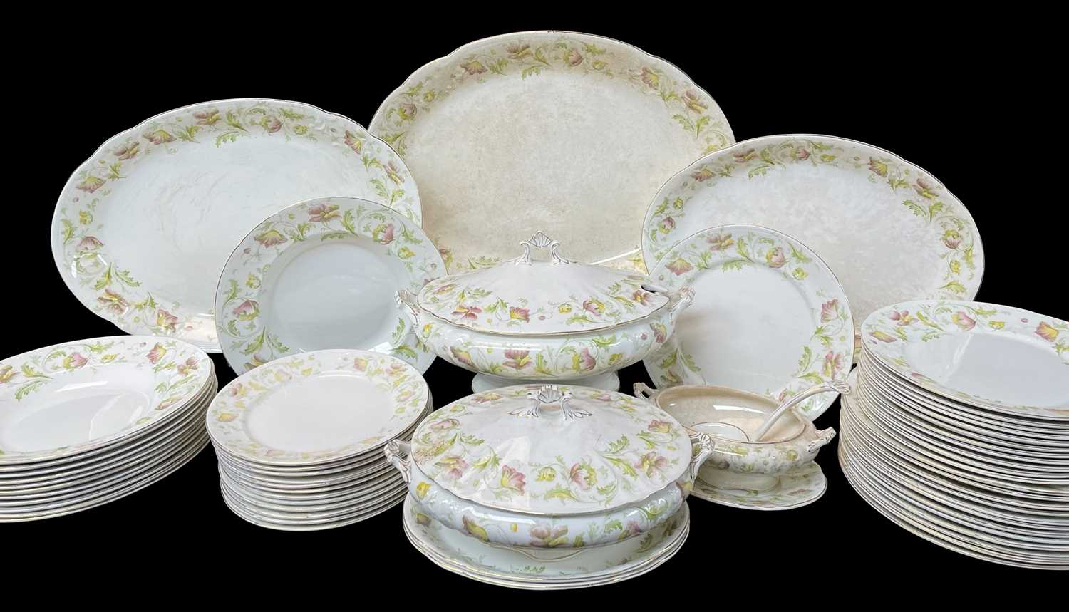 PARCEL EARLY 20TH CENTURY STAFFORDSHIRE DINNERWARE with floral gilt decoration, comprising platters,