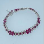 18K WHITE GOLD RUBY & DIAMOND FLOWER BRACELET, 19cms long, 20.9gms, stamped '750', 'D4.30' and '11.