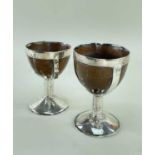 TWO SILVER MOUNTED COCONUT GOBLETS, c. 1800, one with feather engraved decoration, tallest 12cm h (