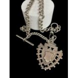 SILVER ALBERT WATCH CHAIN, graduated curblink with T-bar and shield fob dated 1908, 29cm long, 44.