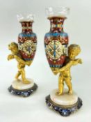 PAIR OF FRENCH CHAMPLEVÉ ENAMEL & GILT BRONZE POSY VASES, modelled as amorini holding amphorae, on