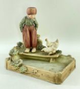 ROYAL DUX PORCELAIN FIGURE OF DUTCH BOY WITH CHICKENS, with maker's mark to base and impressed 2297,