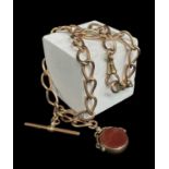 9CT GOLD ALBERT WATCH CHAIN, curb link, with T-bar and revolving carnelian fob, 44.5gms