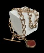 9CT GOLD ALBERT WATCH CHAIN, curb link, with T-bar and revolving carnelian fob, 44.5gms