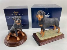 BORDER FINE ARTS FIGURES, standing Rottweiler on wooden base, O73, together with a seated Rottweiler
