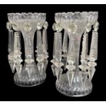PAIR OF VICTORIAN CLEAR GLASS LUSTRES with castellated style cut rims, hollow stem, spreading