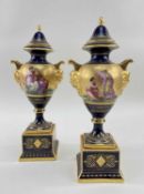 PAIR OF CONTINENTAL VIENNA-STYLE URNS & COVERS, on a square base with gilt handles decorated on
