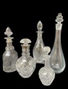 FIVE GLASS DECANTERS, one with hallmarked silver collar, one Edinburgh Crystal, together with a