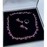 GOLD RUBY & DIAMOND JEWELLERY comprising 18K white gold ruby and diamond flower necklace, 43cms