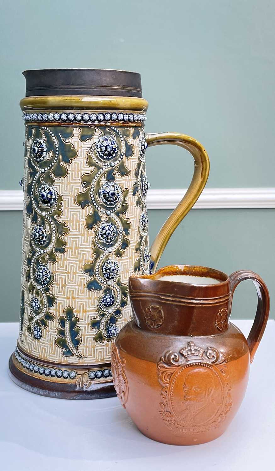 LARGE DOULTON LAMBETH STONEWARE JUG BY GEORGE TINWORTH, decorated with flowerheads and oak leaves,