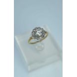 DIAMOND CLUSTER DRESS RING, central brilliant cut stone appr. 0.9cts, within twelve smaller diamonds