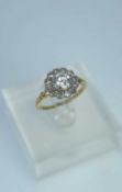 DIAMOND CLUSTER DRESS RING, central brilliant cut stone appr. 0.9cts, within twelve smaller diamonds