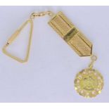18CT GOLD EAGLE EMBOSSED MEDALLION - on a hanging ribbon and fastener, 18.6grms