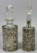 EDWARDIAN SILVER BOTTLE HOLDER with reticulated and embossed decoration, Birmingham 1904, containing