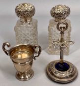 EDWARDIAN SQUARE CUT GLASS SCENT BOTTLE with embossed silver cover, and one other similar, 13cm