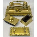 LATE 19TH CENTURY GILDED BRASS DESKSTAND, with twin glass inkwells, similar pen stand, desk blotter,