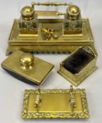 LATE 19TH CENTURY GILDED BRASS DESKSTAND, with twin glass inkwells, similar pen stand, desk blotter,