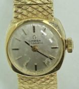 OMEGA 9CT GOLD LADY'S BRACELET WRISTWATCH - circular dial set with baton markers, the movement