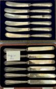 SET OF SIX SILVER HANDLED DESSERT KNIVES, in fitted case, and another similar set. (2).