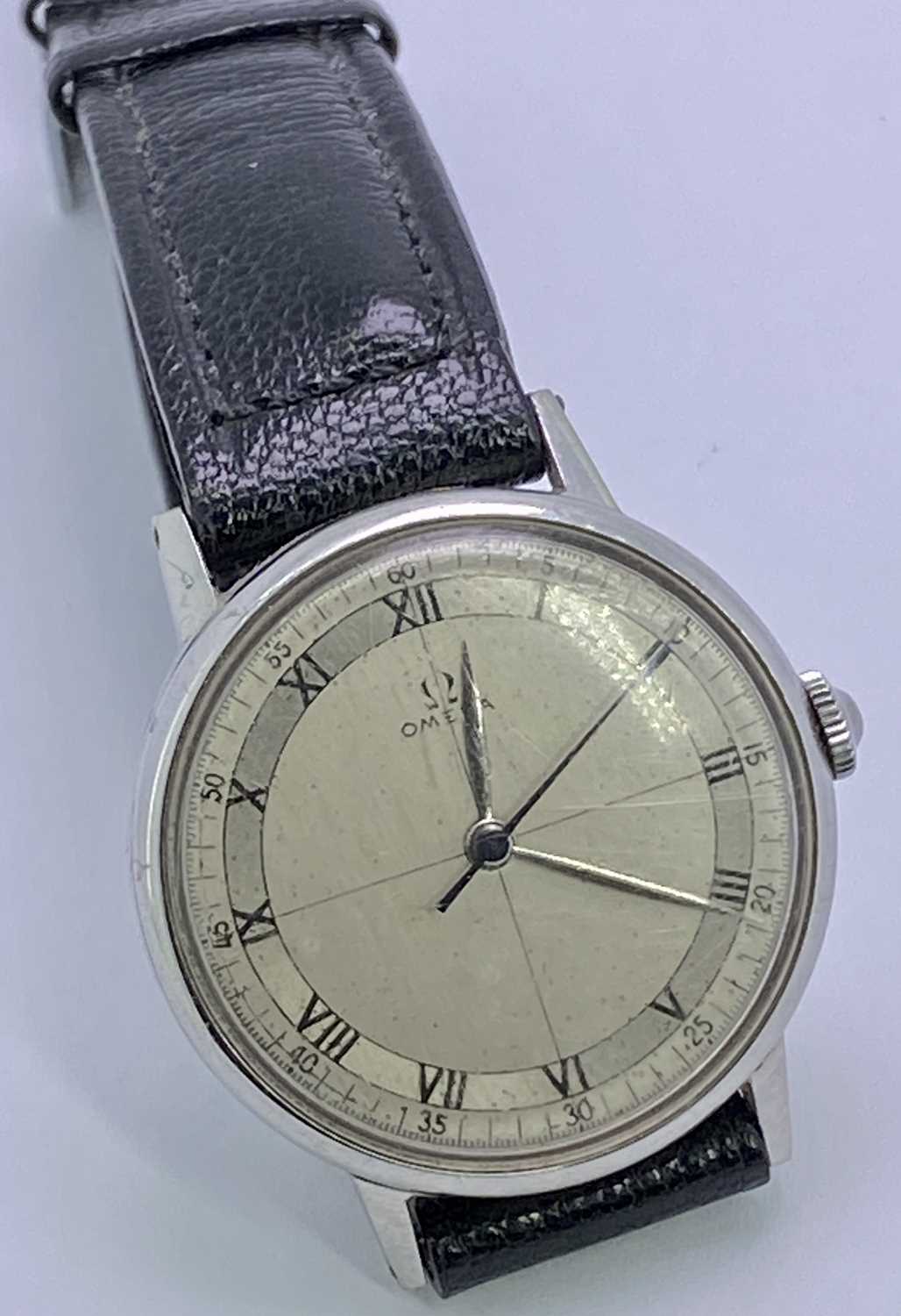 VINTAGE OMEGA GENT'S STAINLESS STEEL WRISTWATCH - with black leather strap, having a quartered and