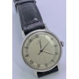 VINTAGE OMEGA GENT'S STAINLESS STEEL WRISTWATCH - with black leather strap, having a quartered and