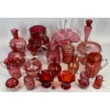 CRANBERRY GLASS - an assortment of various vases and bowls, also, a quantity of paperweights and