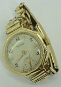 LADY'S ROTARY 9CT GOLD CASED WRISTWATCH - on a rolled gold bracelet, octagonal case, the dial set