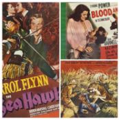THREE REPRODUCTION COLOUR FILM POSTERS in lightwood frames, "King of the Wild", "Erroll Flynn in Sea