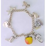 SILVER CHARM BRACELET - with several charms including a non-silver fruit charm, 1.045ozt gross