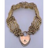 9CT GOLD GATE LINK BRACELET - with heart shaped locket, 21.6grms