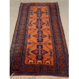 EASTERN RUG - blue and red ground with repeating diamond/zig zag central pattern and multi