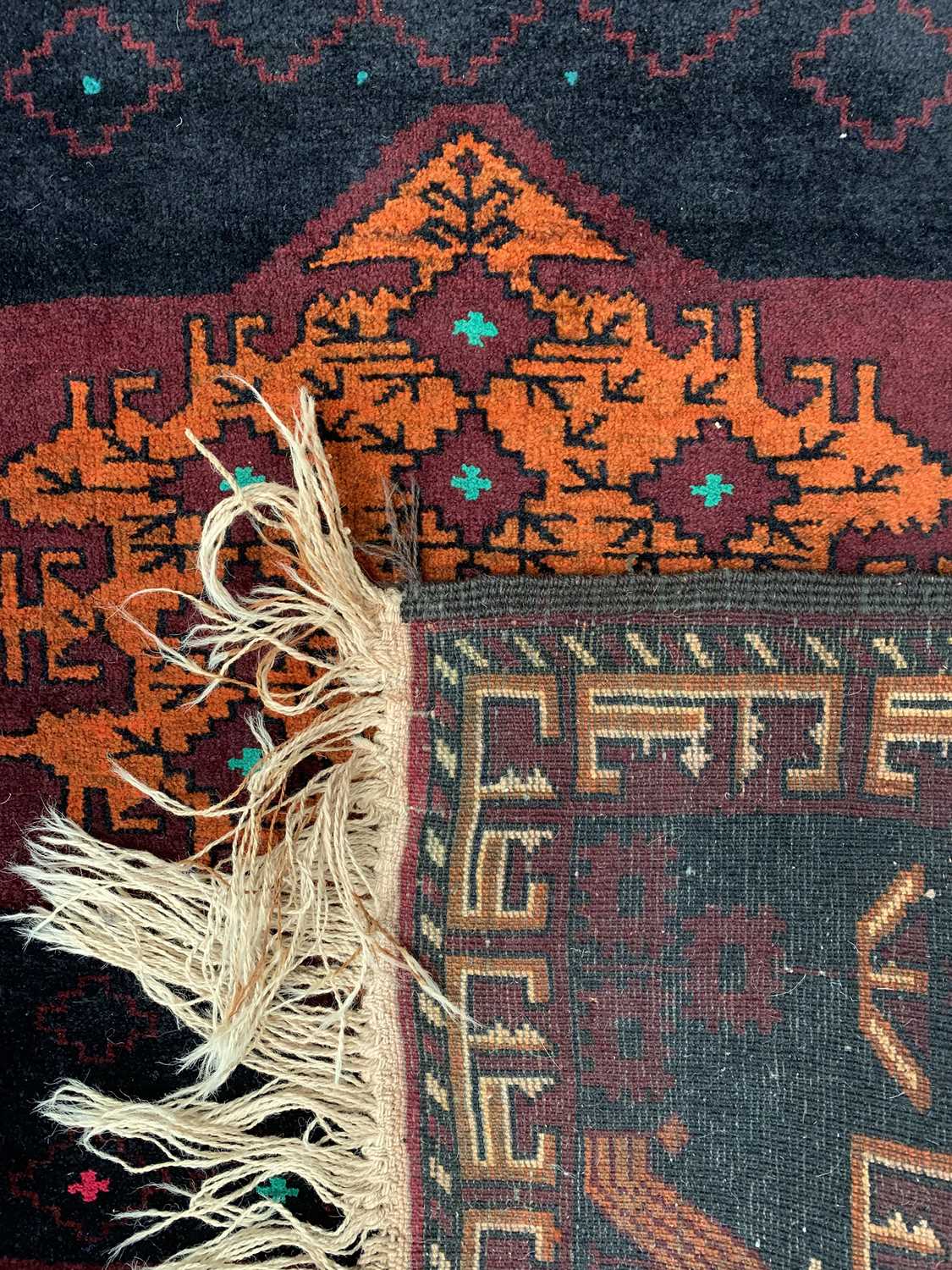 EASTERN RUG - various blues and reds ground with tasselled ends and triple diamond central - Image 2 of 2