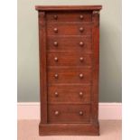 VINTAGE OAK WELLINGTON CHEST - 7 drawers with turned wooden knobs and carved detail to the uprights,