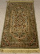 ORNATE WOOLLEN RUG - multi-coloured floral pattern and tasselled ends, 81 x 145cms