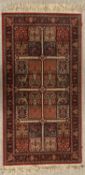 EASTERN RUG - red ground, sectional tree pattern, labelled "Kirman Shah", 161 x 83cms