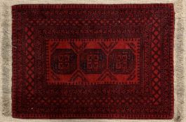 AFGHANISTAN RUG - red ground with multi border and central diamond motif, 147 x 106cms