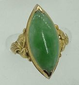 18CT GOLD JADE RING - the ellipse shape stone measuring 21mm x 10mm, slightly cabochon and top