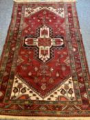 RUGS - with central cross design, multi-bordered edge and red tasselled ends, 215 x 128cms