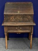AN 18TH CENTURY OAK BIBLE BOX - sloping lift-up lid enclosing interior fitted with four drawers,