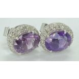 AMETHYST & DIAMOND CLUSTER EARRINGS, A PAIR - unmarked white metal in a Boodle & Dunthorne box,