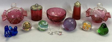 PAIR OF CRANBERRY GLASS BASKETS with clear glass handles, 16cms dia., with various glass