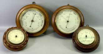 FOUR OAK CASED ANEROID WALL BAROMETERS, the largest 28cms dia.