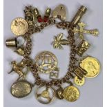 EXCELLENT 9CT GOLD CHARM BRACELET - with padlock clasp holding 20 various charms to include a 1914