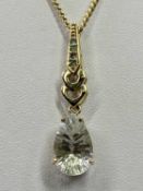 9CT GOLD PEAR DROP FACET CUT CRYSTAL SET NECKLACE - stamped '9-375' the pear drop pendant claw set