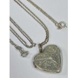925 BRIGHT CUT SILVER HEART SHAPED LOCKET and fine link chain, total 7.5grms, and a 925 fine link
